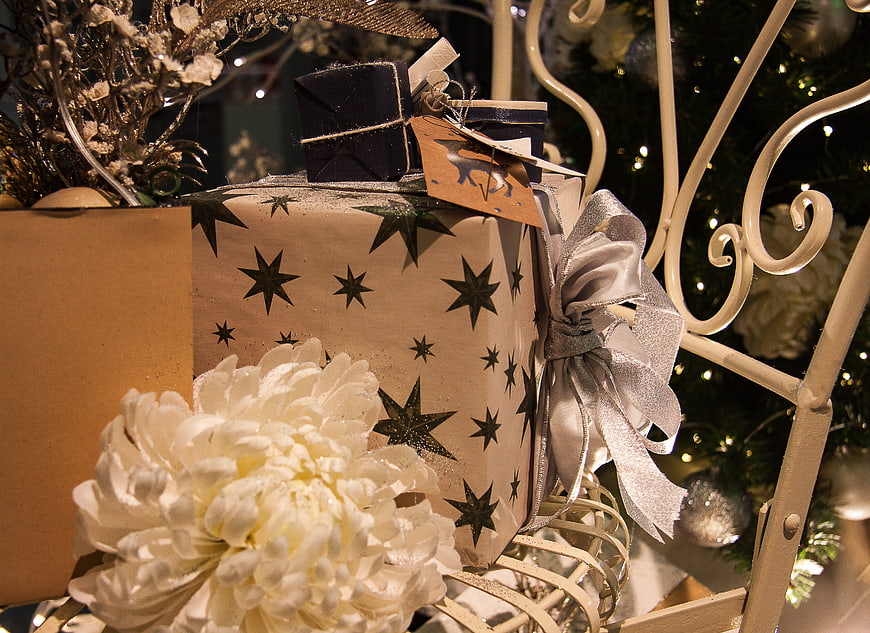 Elegant Christmas Gifts with Silver Bow and White Flower