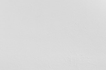 White textured wall background with subtle plaster details