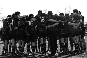 Rugby Team Huddle in Black and White
