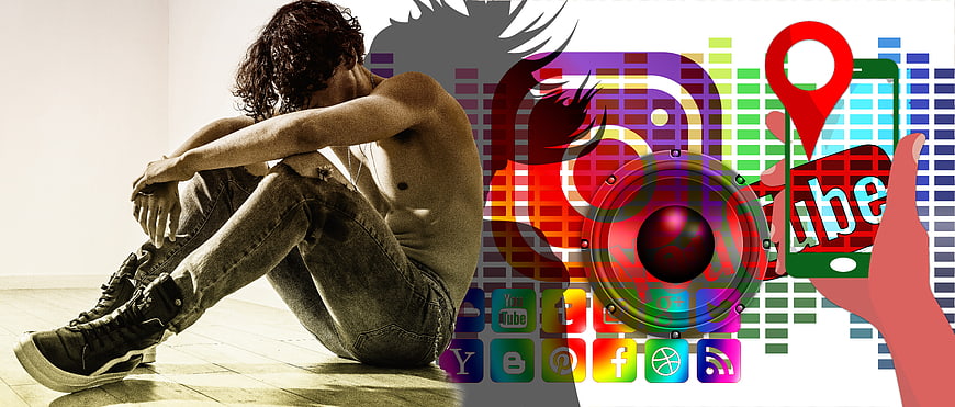 Depressed Youth Sitting Beside Colorful Social Media Icons