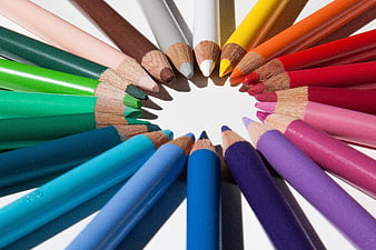 Colorful Pencils Arranged in a Circle on White Background