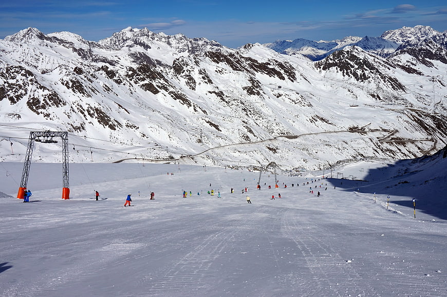 Wide View of Skiers on Snowy Slopes in the Austrian Alps