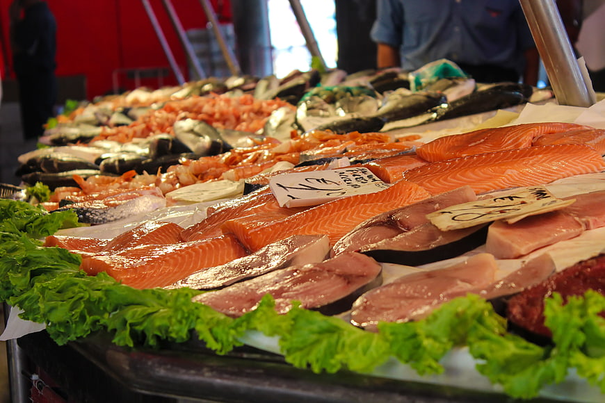 Fresh Salmon Fillets and Seafood at Market Stall
