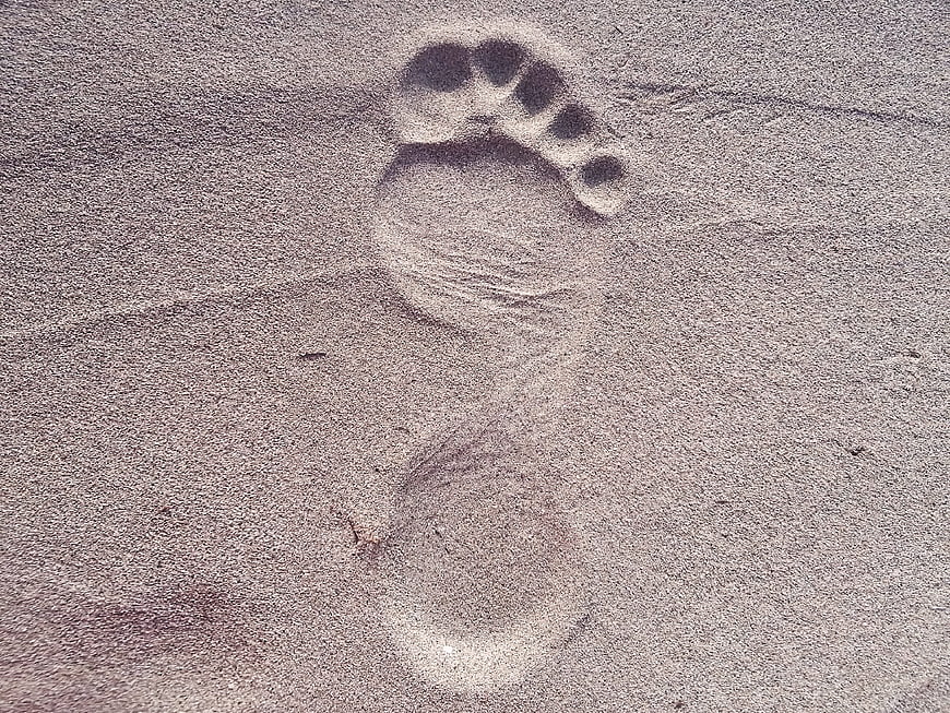 Single Bare Footprint in Sand