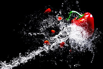 Red Bell Pepper Splash in Water on Black Background
