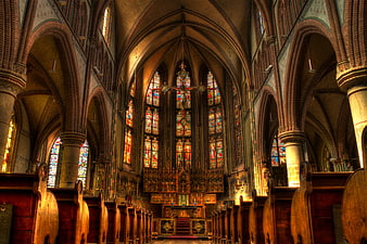 Gothic Cathedral Interior with Stained Glass and Brick Arches