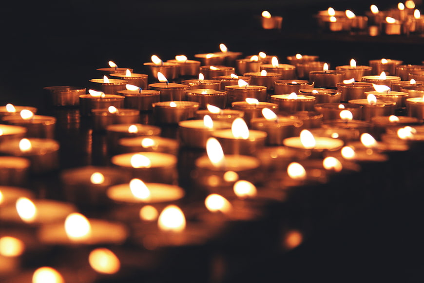 Glowing Christmas Candles In Dark Setting