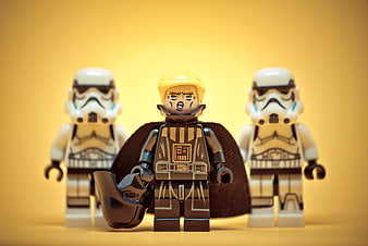 Lego Star Wars minifigures with political parody on yellow background