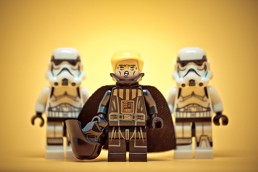Lego Star Wars minifigures with political parody on yellow background
