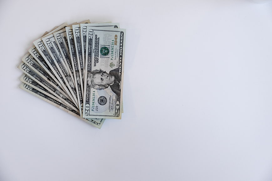 Fan of Twenty Dollar Bills on White Background