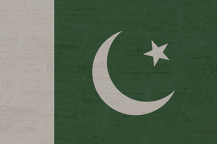 Textured Pakistan Flag on Weathered Green Background