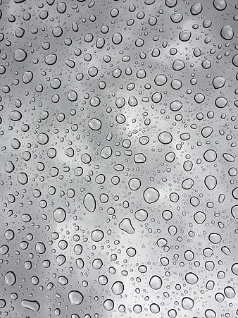 Raindrops on glass window texture background