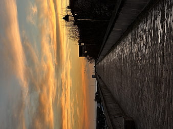 Vertical Sunset Sky Over Brick Wall and Silhouette