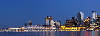 Vancouver Skyline at Night with Canada Place and Water Reflections