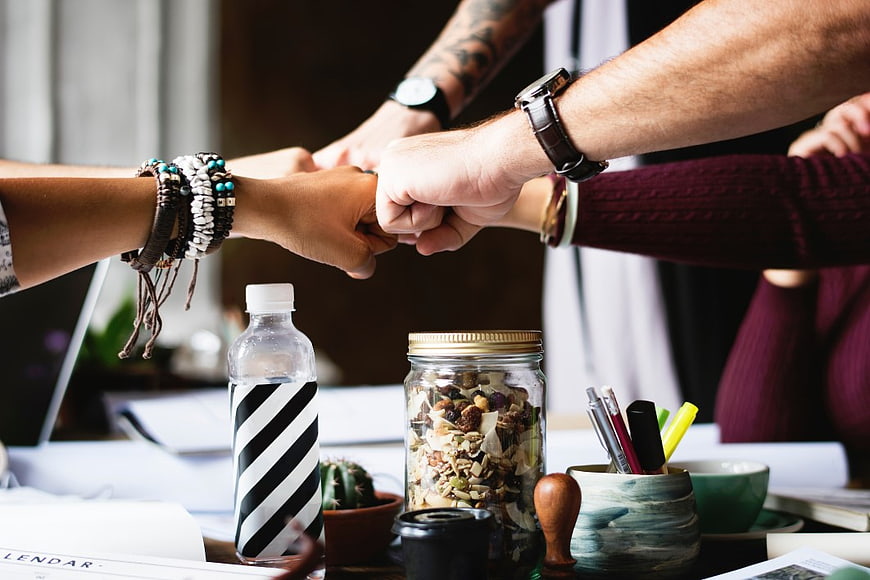 Office Team Fist Bump Collaboration Concept