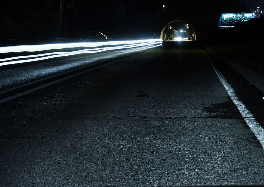 Long Exposure Night Highway with Light Trails and Tunnel
