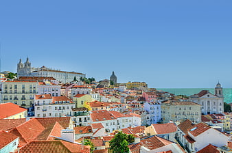 Colorful Alfama District Rooftops and Lisbon Skyline with Ocean View