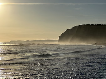 Golden Hour Seascape with Cliffs and Ocean Waves