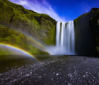 Majestic Skogafoss Waterfall with Rainbow in Iceland
