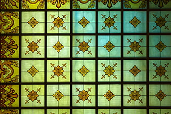 Vintage stained glass window with floral patterns