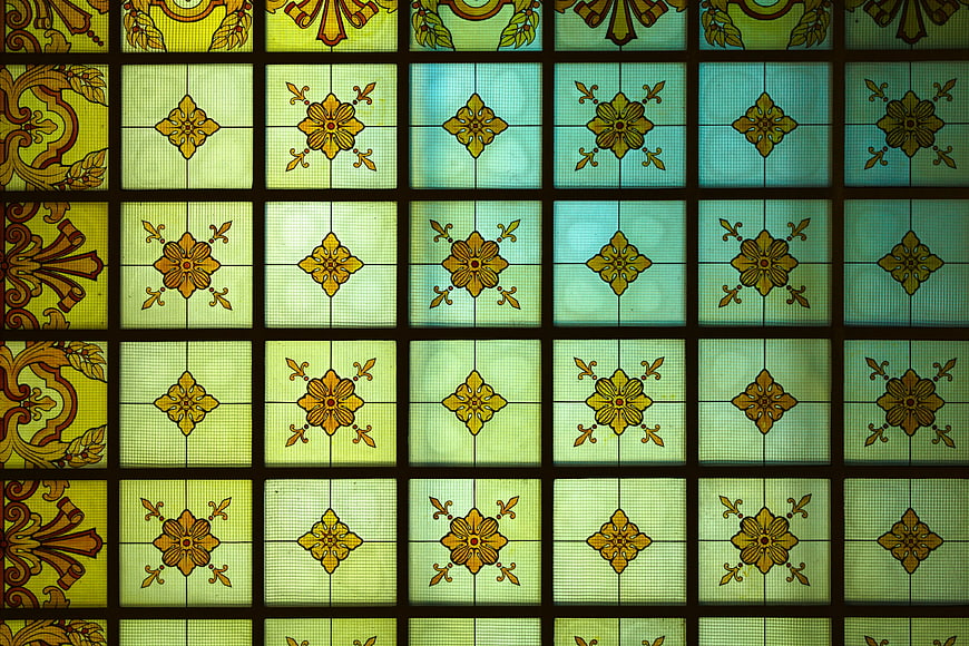Vintage stained glass window with floral patterns