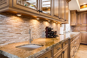 Luxury Kitchen Interior With Granite Countertops And Wood Cabinetry