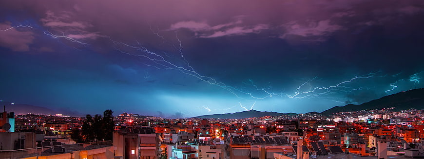 Panoramic Lightning Storm Over Athens Cityscape at Night