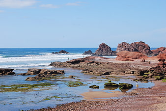 Red Rock Coastal Landscape with Ocean Waves and Tide Pools