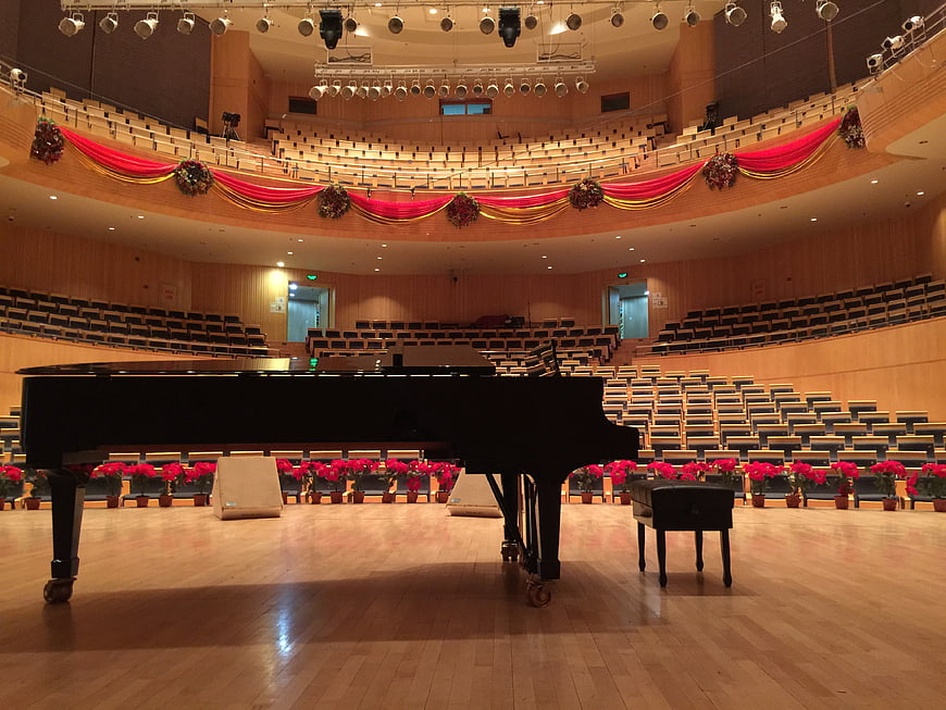 Empty Grand Piano In Decorated Concert Hall