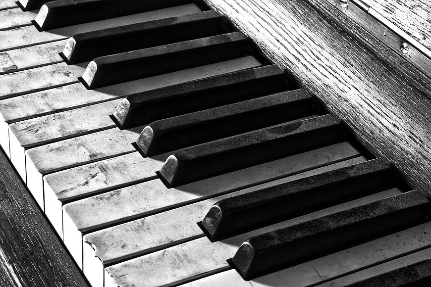 Close-up of weathered black and white piano keys