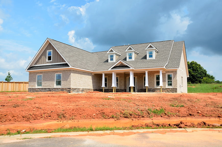 Newly Built House on Red Dirt Construction Site