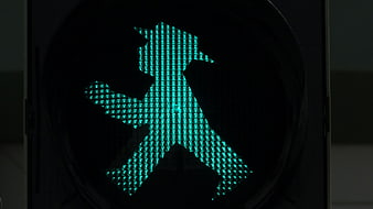 Close-up of green East German pedestrian traffic light signal