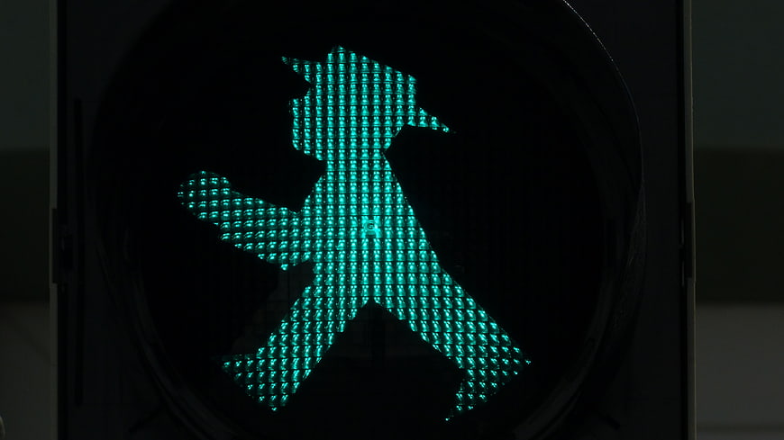 Close-up of green East German pedestrian traffic light signal