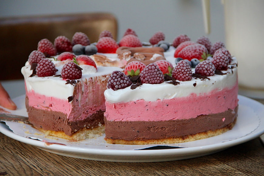 Layered Berry and Chocolate Cheesecake with Fresh Raspberries