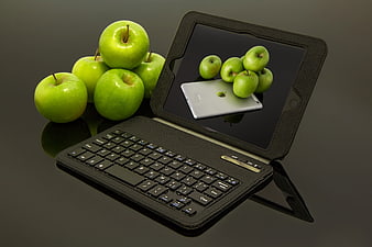 Black Tablet Keyboard Case With Green Apples On Dark Surface