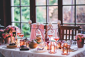 Elegant Christmas Table Setting with Pink Roses and Candles