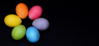 Colorful Easter Eggs Arranged in a Circle on Black Background