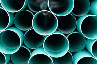 Stacked Teal PVC Pipes Industrial Background