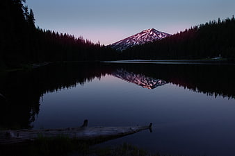 Serene Mountain Lake Reflection at Dusk with Snow-Capped Peak
