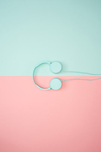 Minimalist Mint Headphones on Pastel Pink and Blue Background