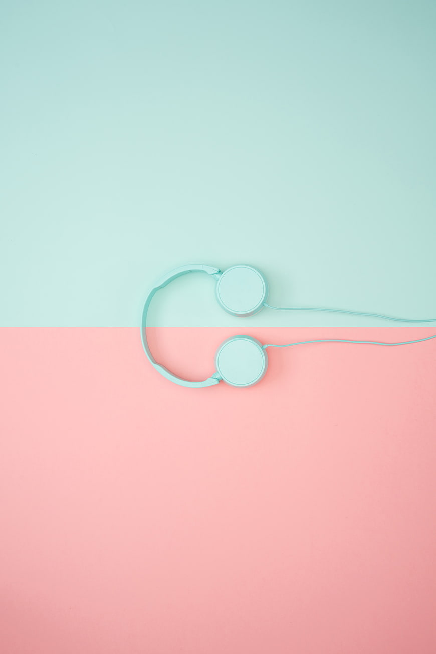 Minimalist Mint Headphones on Pastel Pink and Blue Background