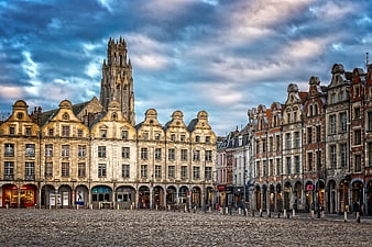 Historic Market Square in Arras, France with Gothic Church Tower