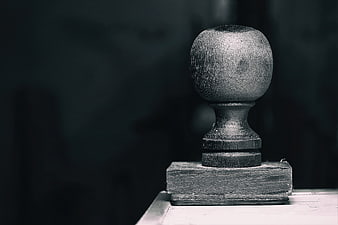 Close-up of vintage wooden stamp handle on desk