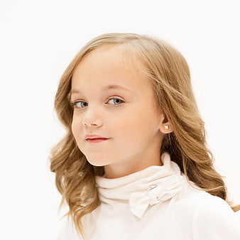 Portrait of a cute little girl with blonde hair and blue eyes