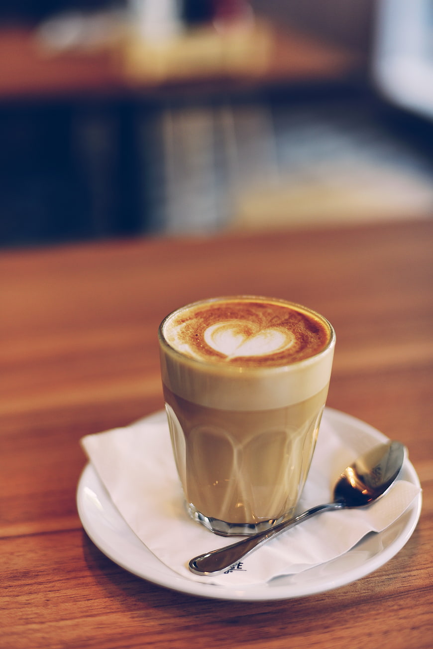 Latte with Heart Art on Wooden Table