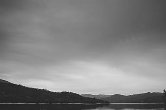 Serene Black and White Lake and Mountain Landscape