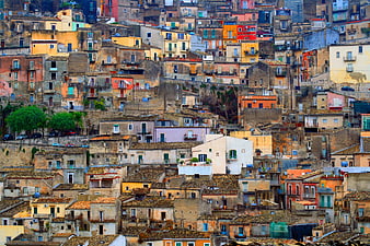Colorful Mediterranean hillside village with terracotta roofs
