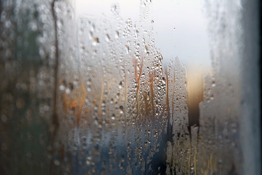 Raindrops on a Window Pane with Blurred Background