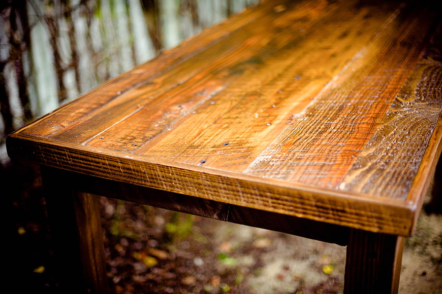 Close-up of rustic wooden table surface with natural grain texture