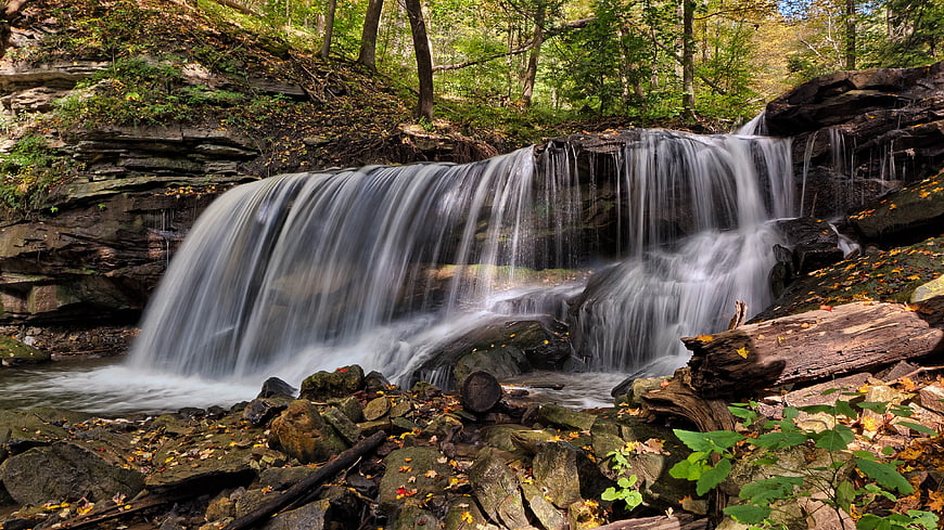 Serene Forest Waterfall with Smooth Water Flow